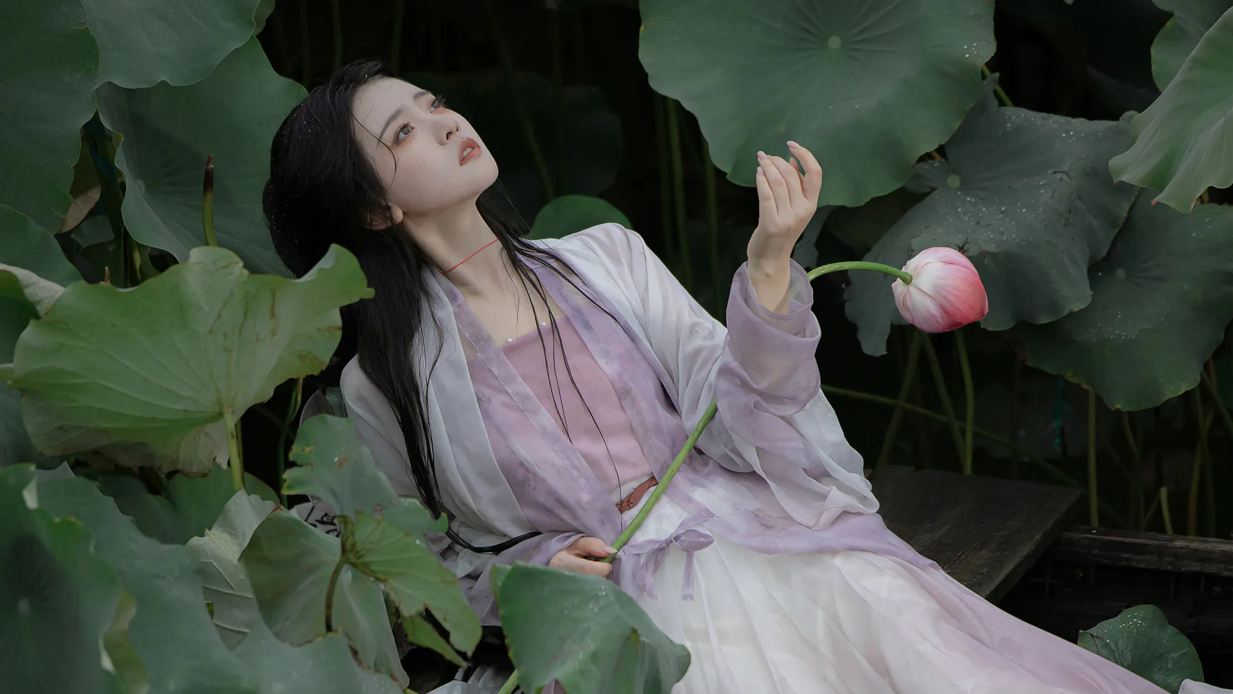 Ethereal Woman in Lavender Gown with Lotus Flower 4K Wallpaper