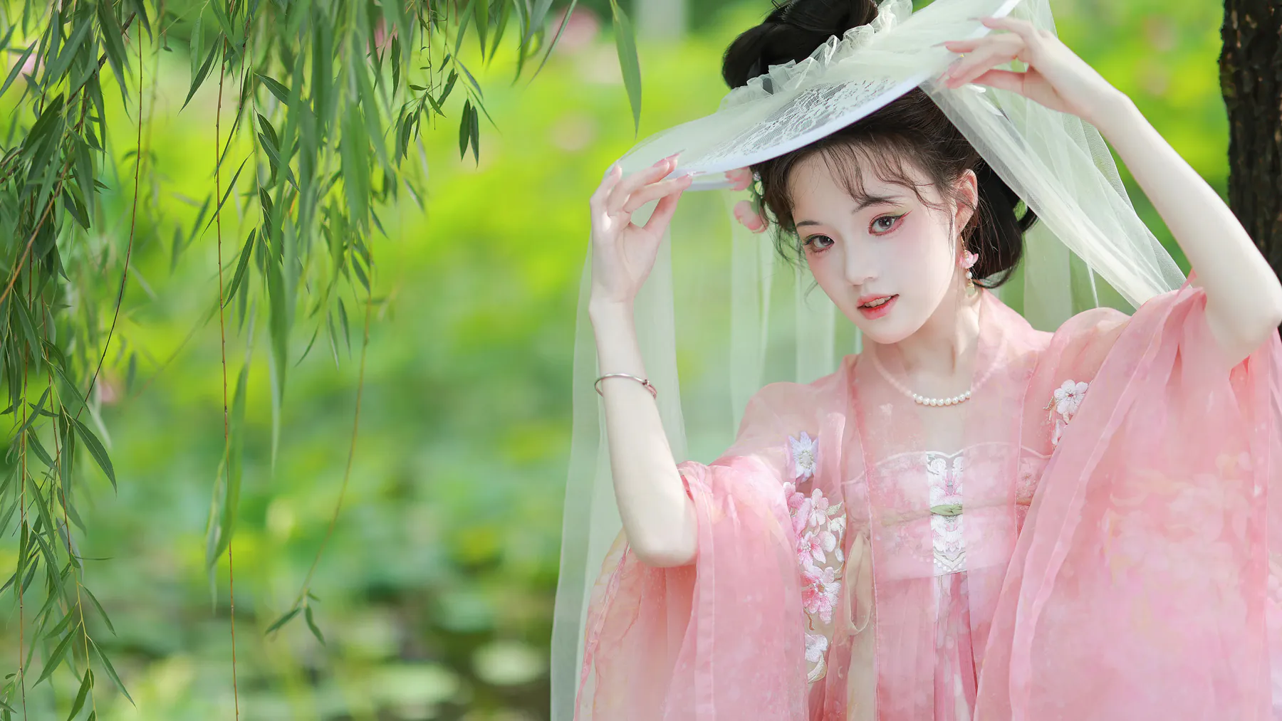 Romantic Asian Woman in Pink Embroidered Hanfu Dress 4K Wallpaper